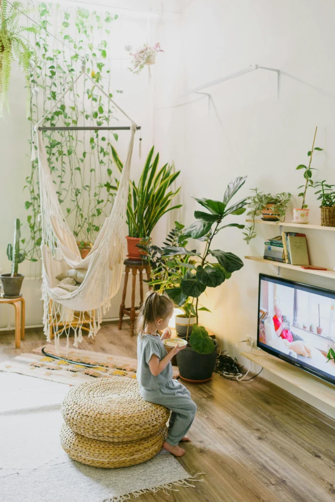 Cozy living room with hammock swing and abundant plants