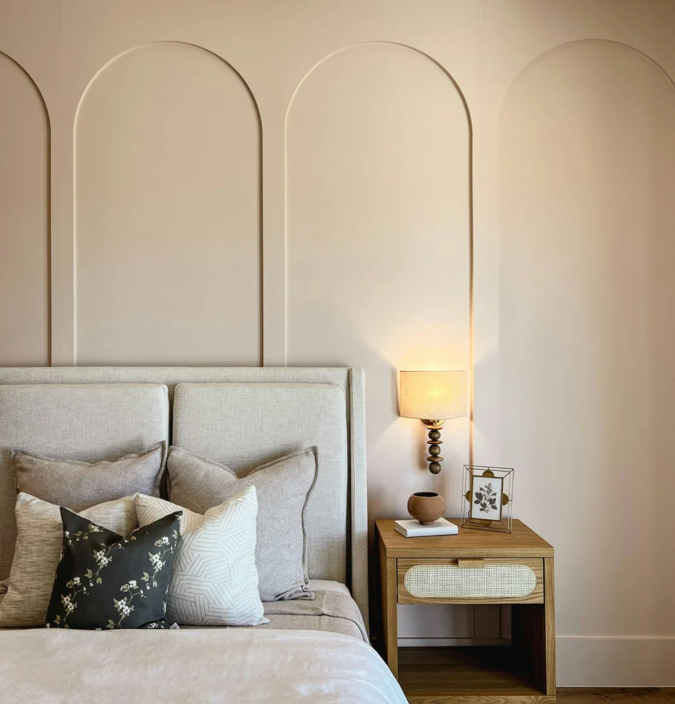 Bedroom with arched wall moldings
