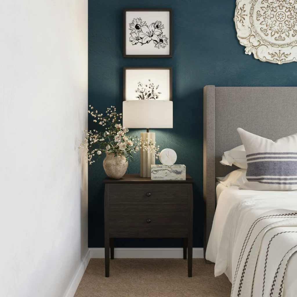 Bedroom with dark teal accent wall and classic decor