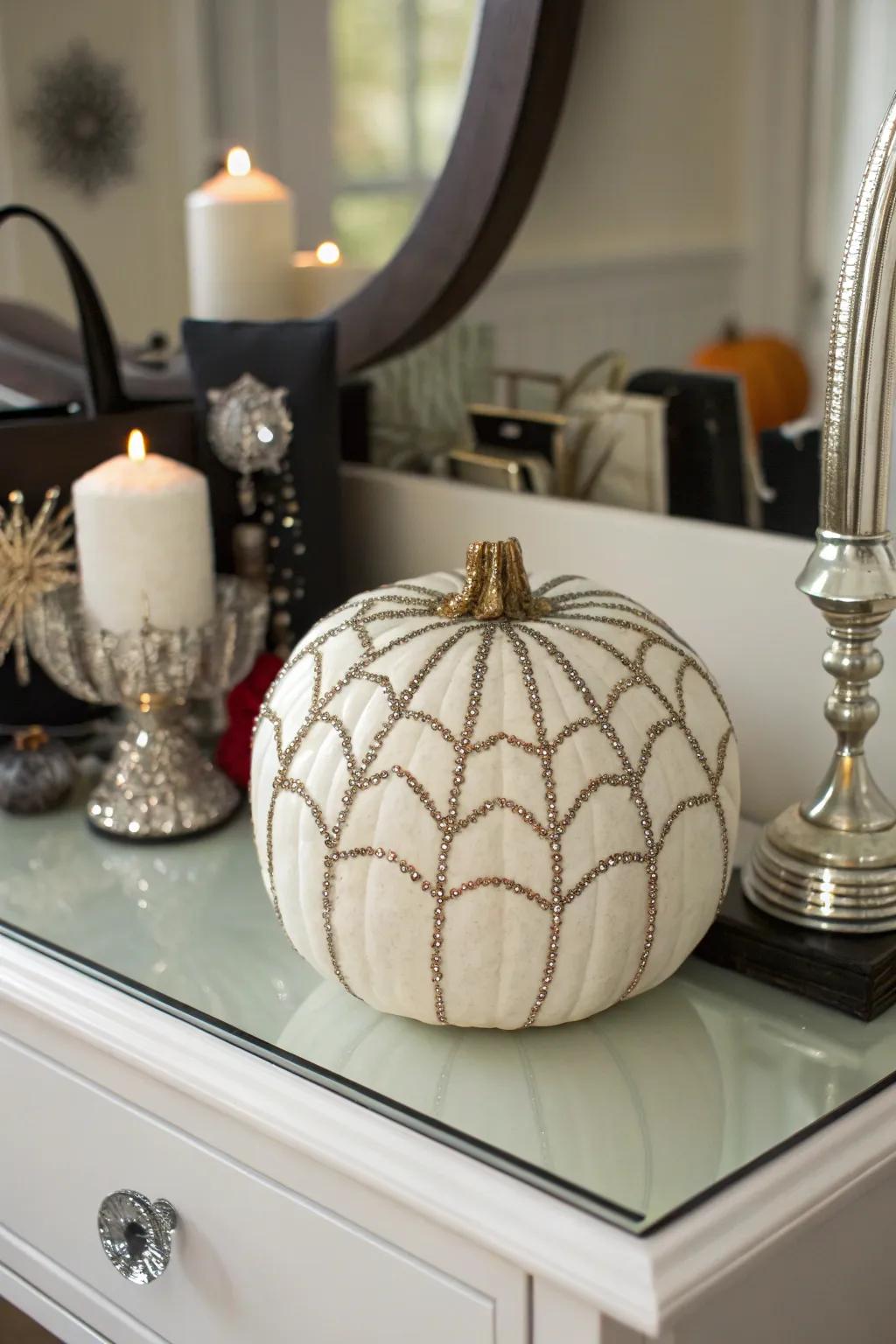 Pumpkin adorned with sparkling sequined spider web