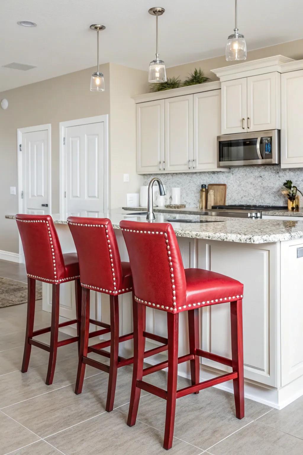Red bar stools create a striking focal point in this modern kitchen.