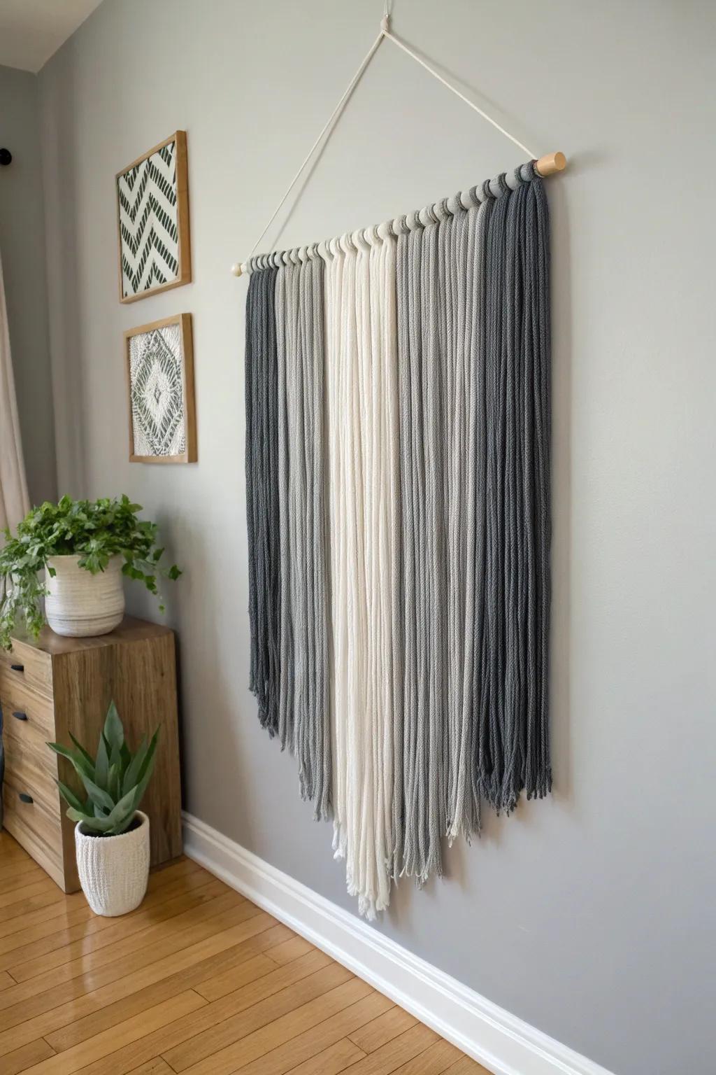 Achieve minimalist elegance with monochrome yarn wall art.