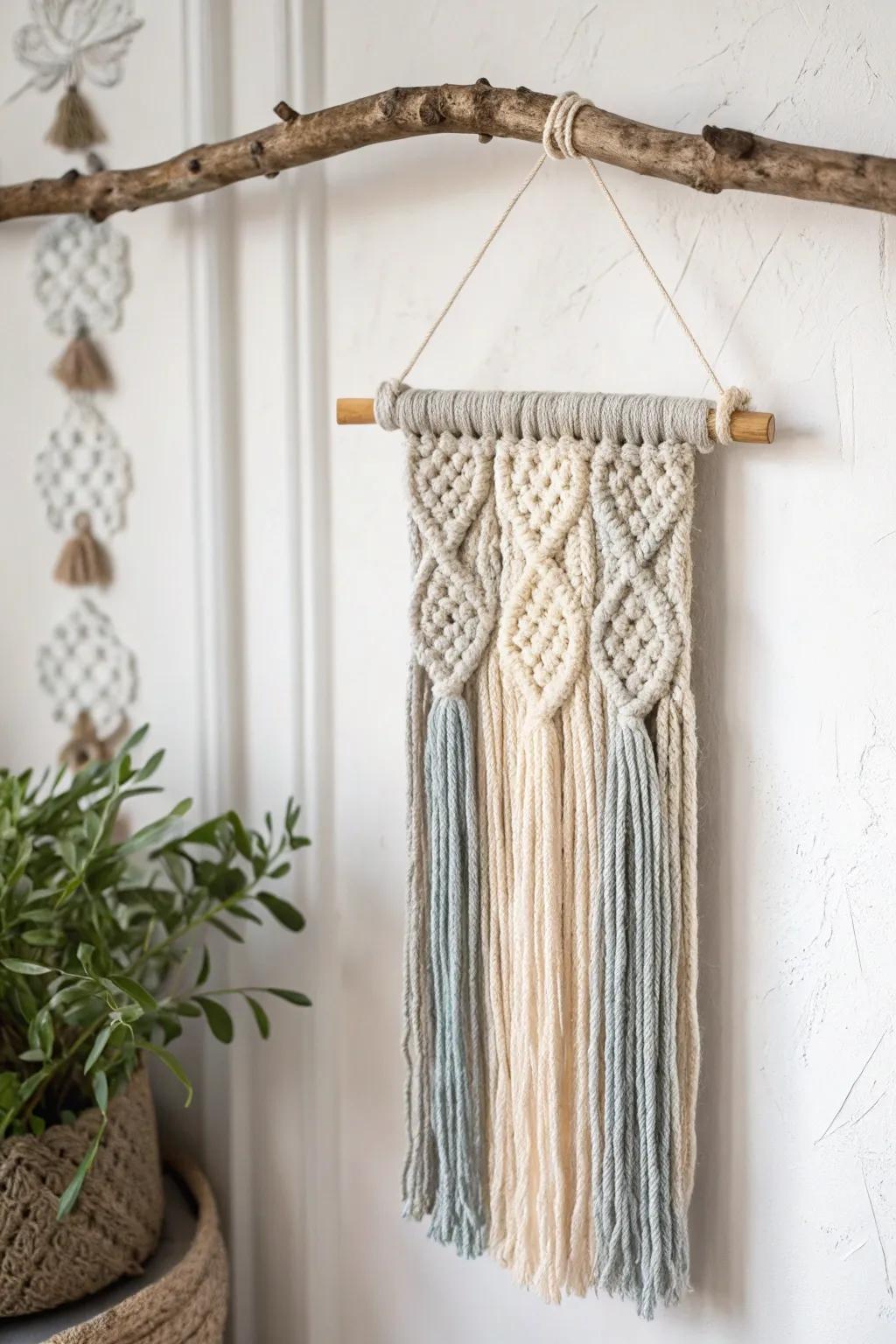 Rustic yarn wall hanging framed with natural twigs for a cozy vibe.