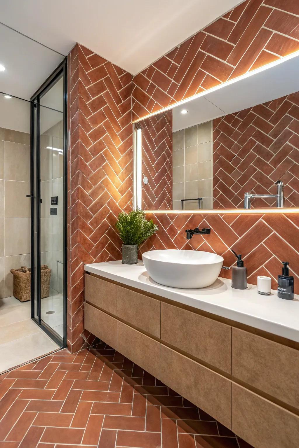 Terra cotta subway tiles arranged in a stylish herringbone pattern.