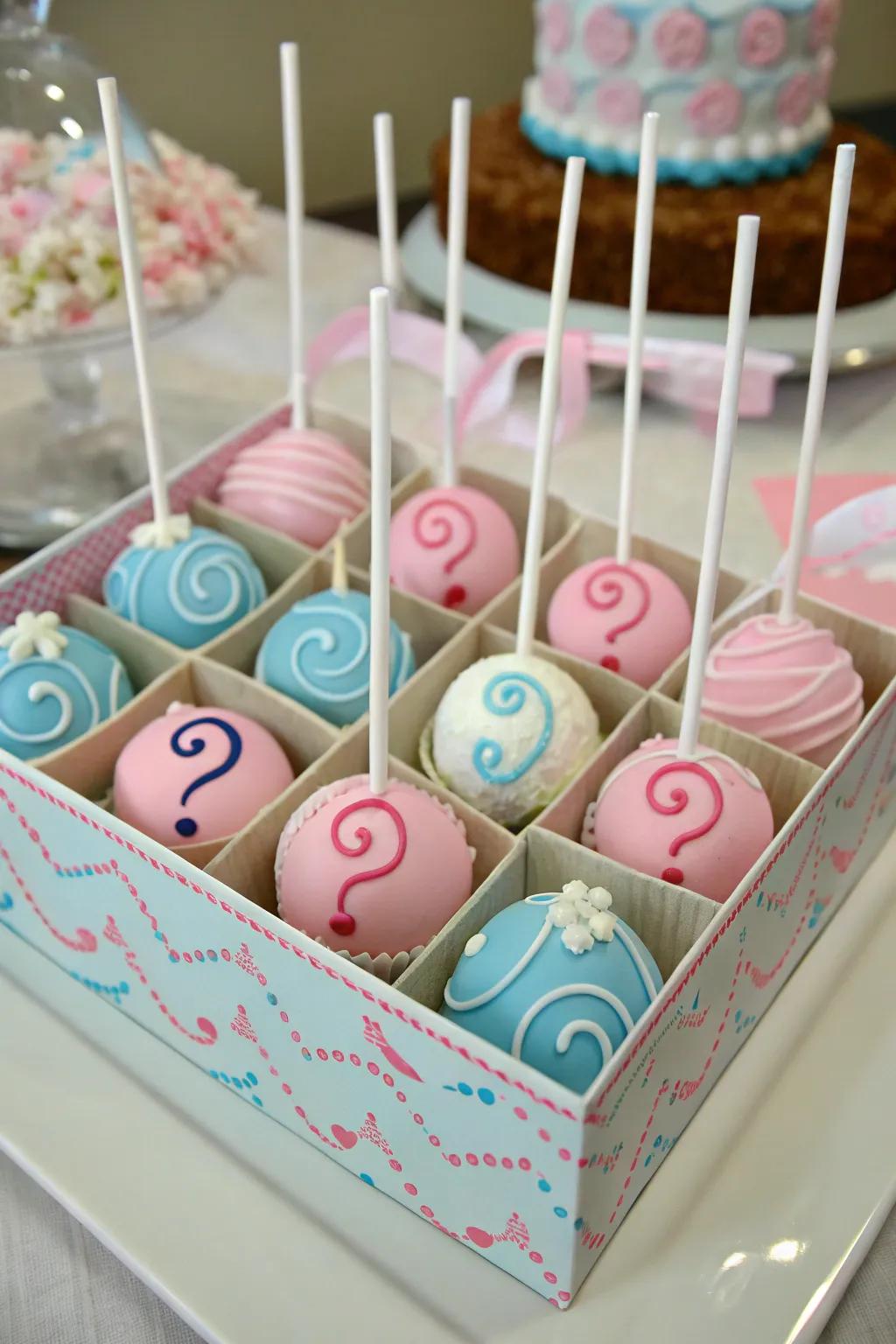 Gender reveal cake pops with hidden surprises.