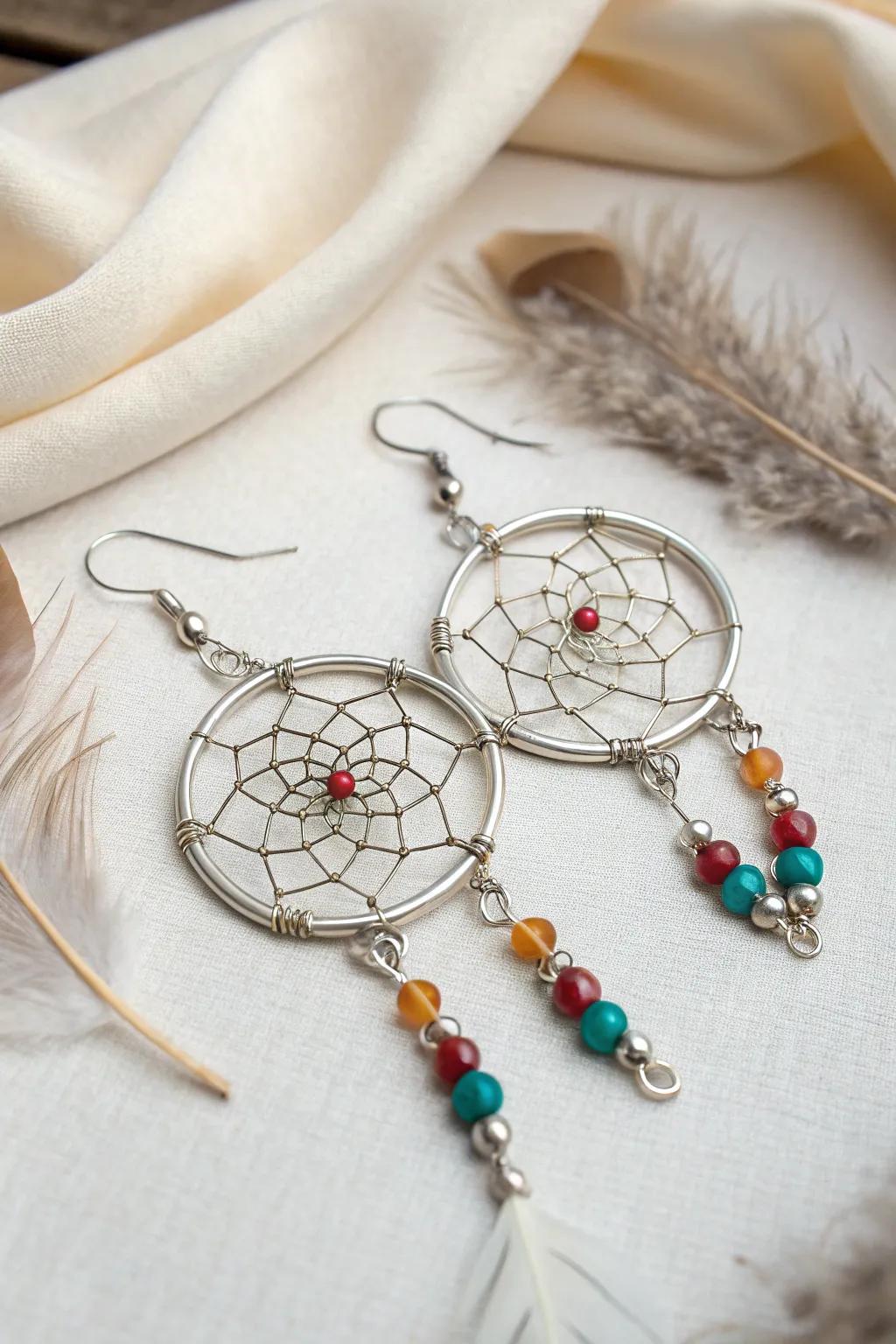 Bohemian dreamcatcher wire earrings combining delicate webs and whimsical beads.