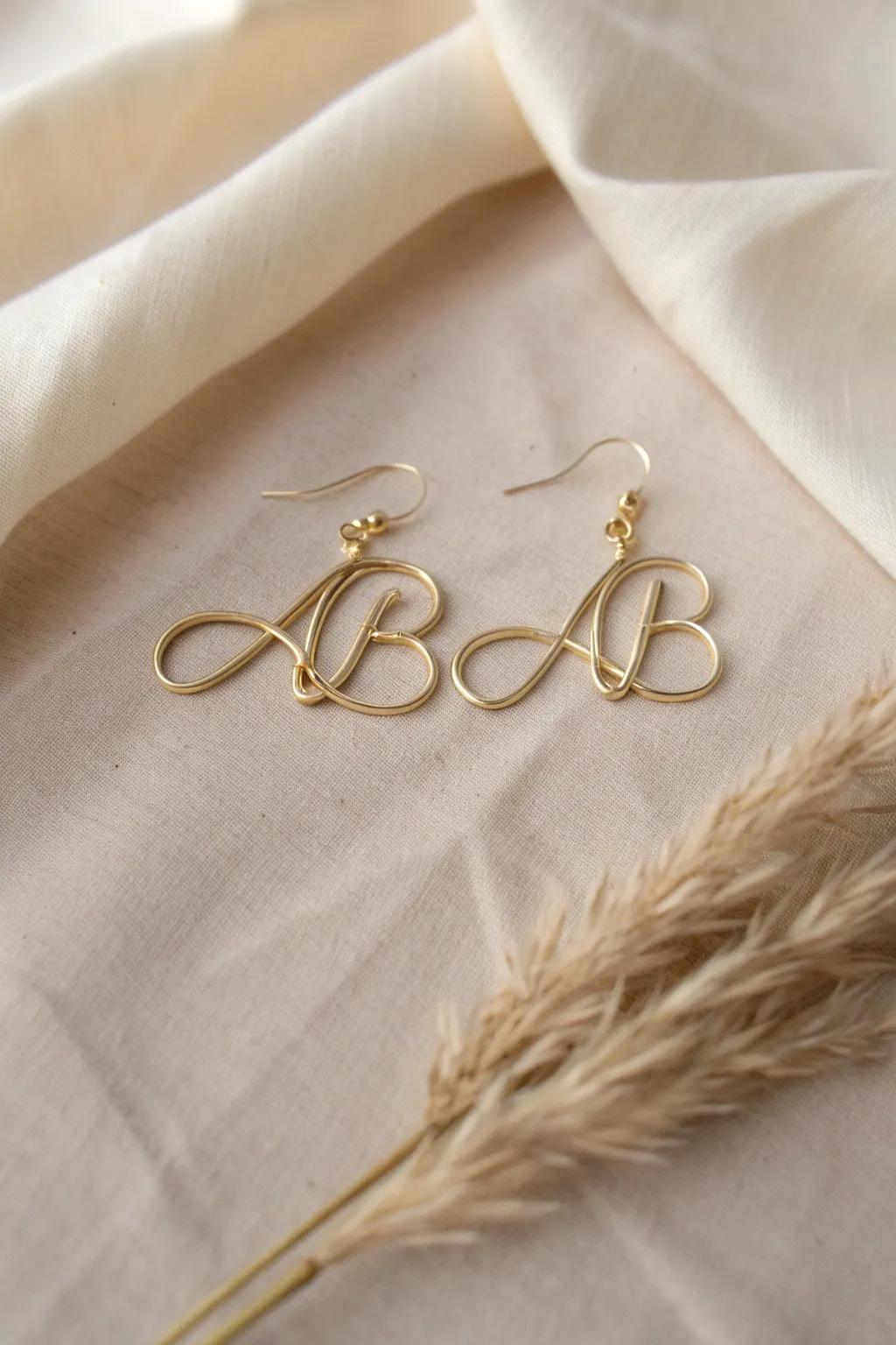 Personalized wire earrings shaped into initials, combining simplicity with heartfelt meaning.