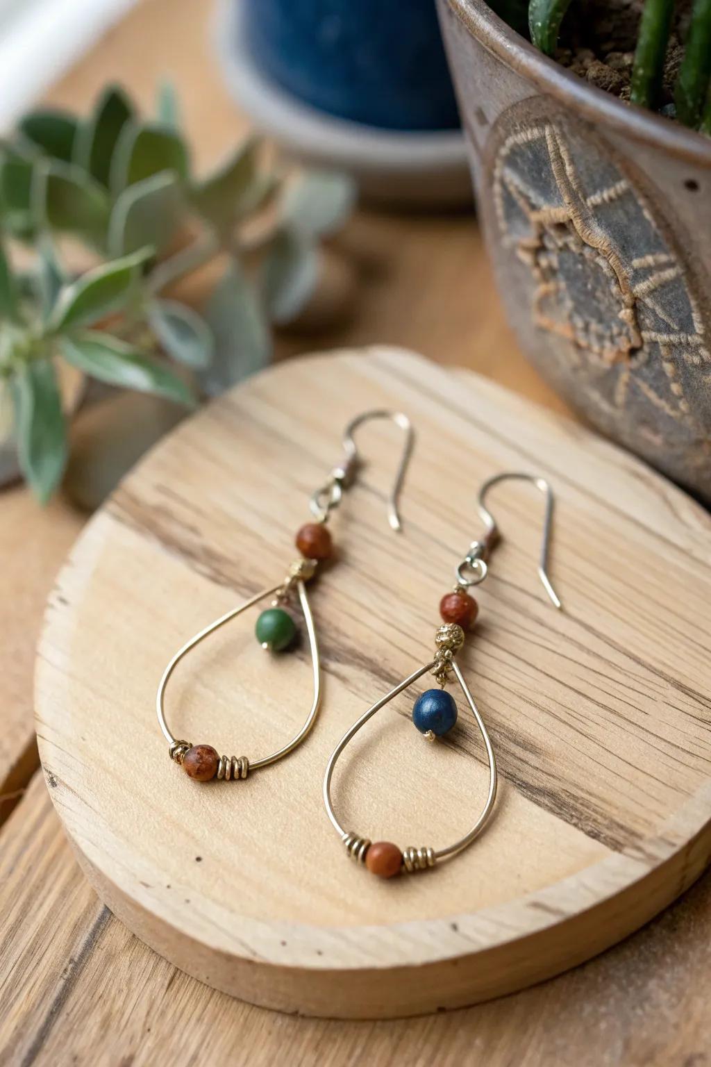 Handmade wire earrings adorned with vibrant beads for a lively and textured appearance.