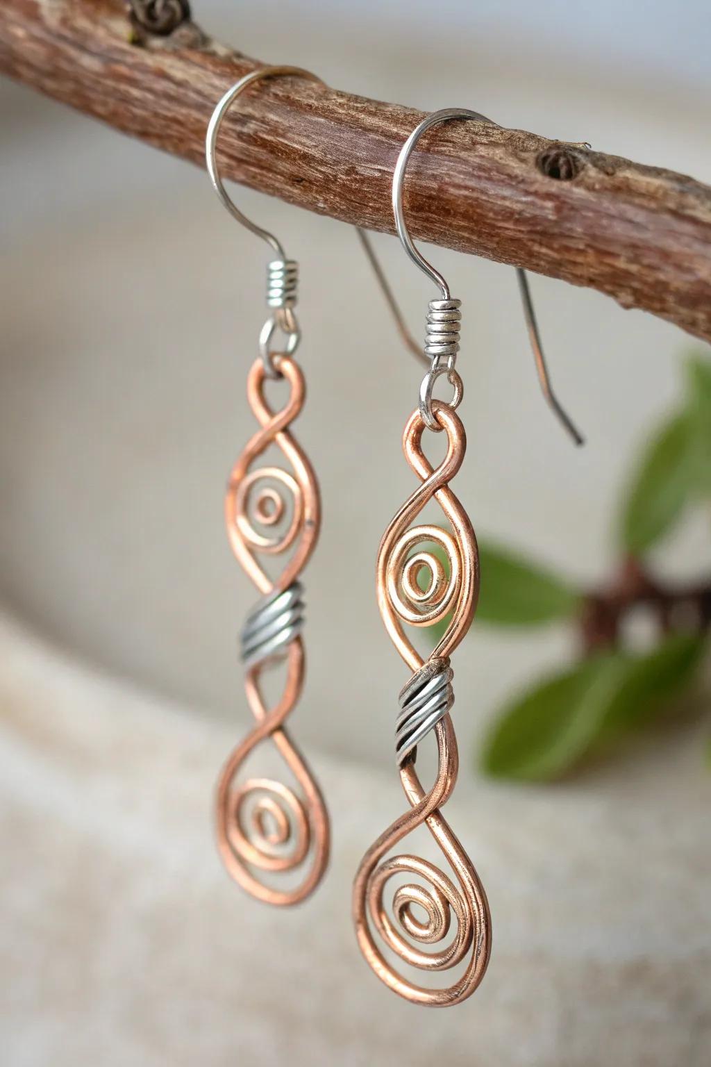 Striking contrast in earrings made from copper and silver wire, showcasing mixed metal artistry.
