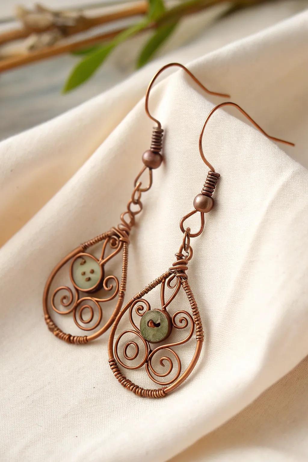 Wire earrings featuring vintage elements like antique buttons and classic charms.