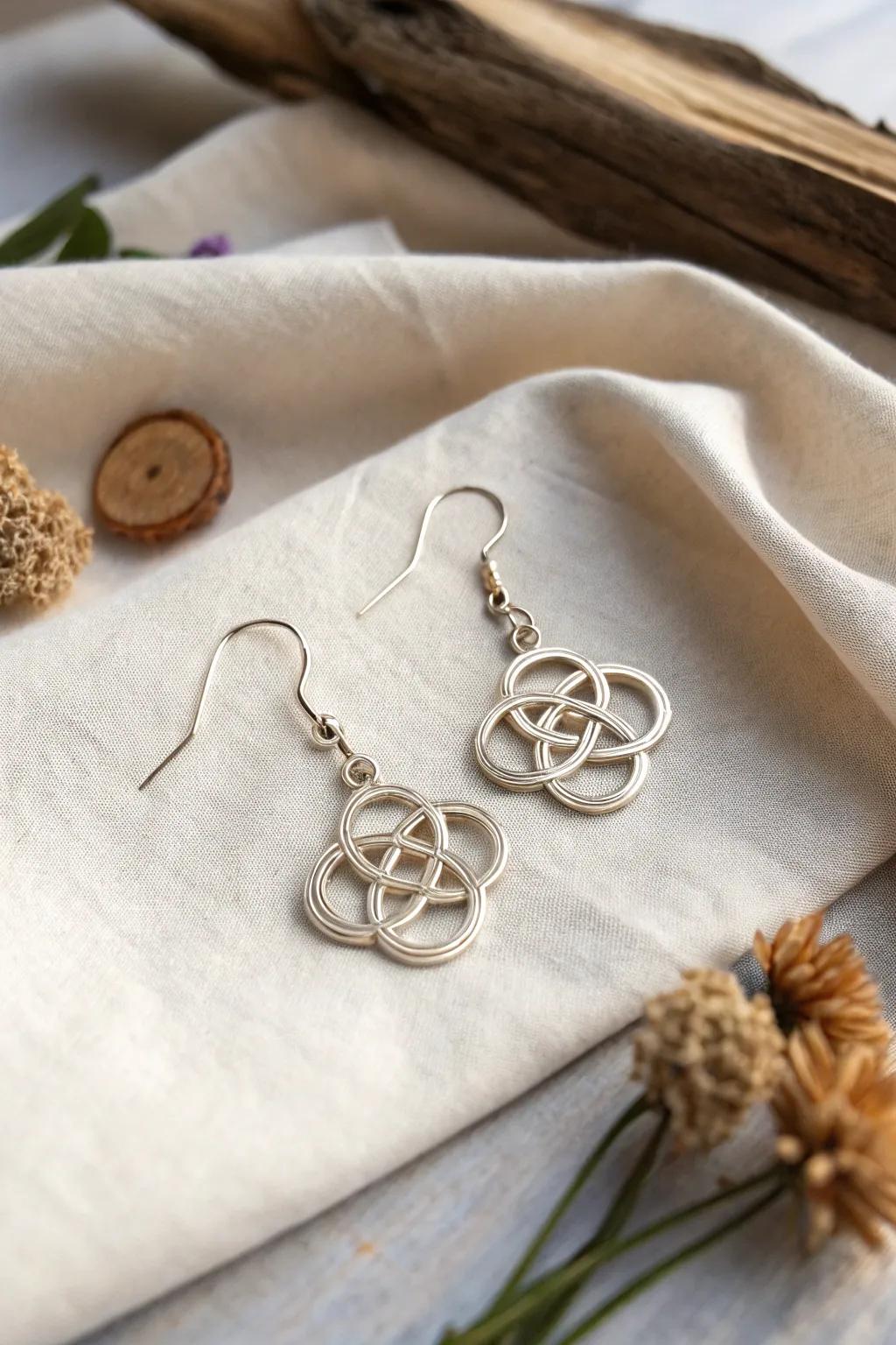 Delicate wire earrings featuring intricate Celtic knot patterns, blending tradition with elegance.