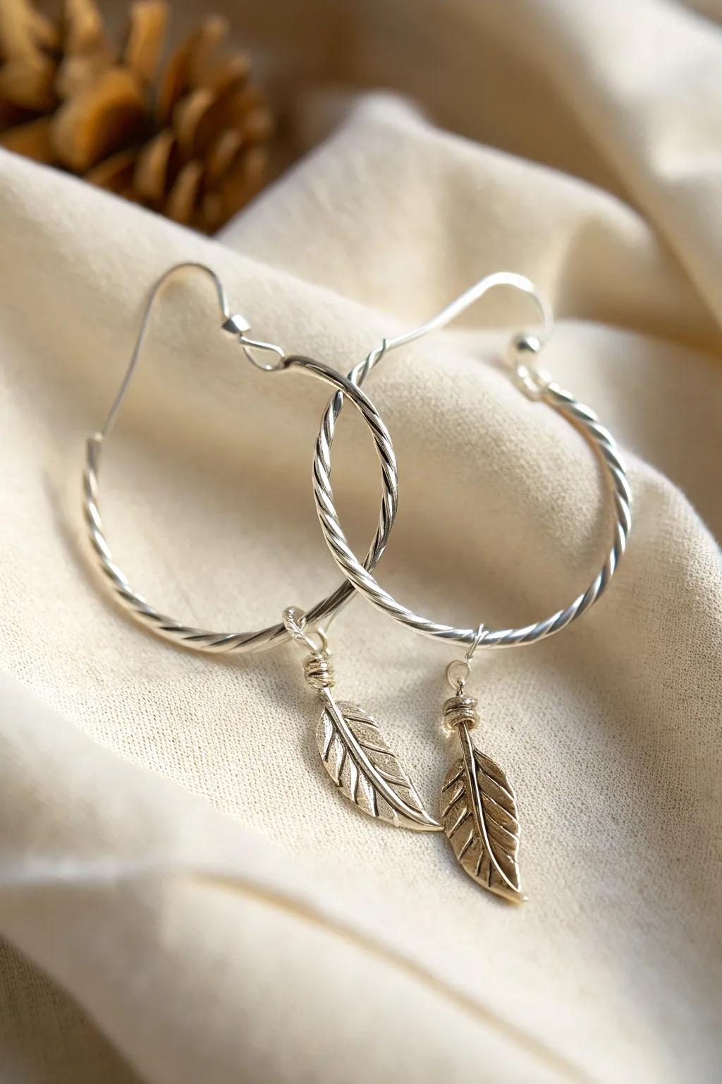 Wire earrings enhanced with delicate nature-inspired charms for added personality.