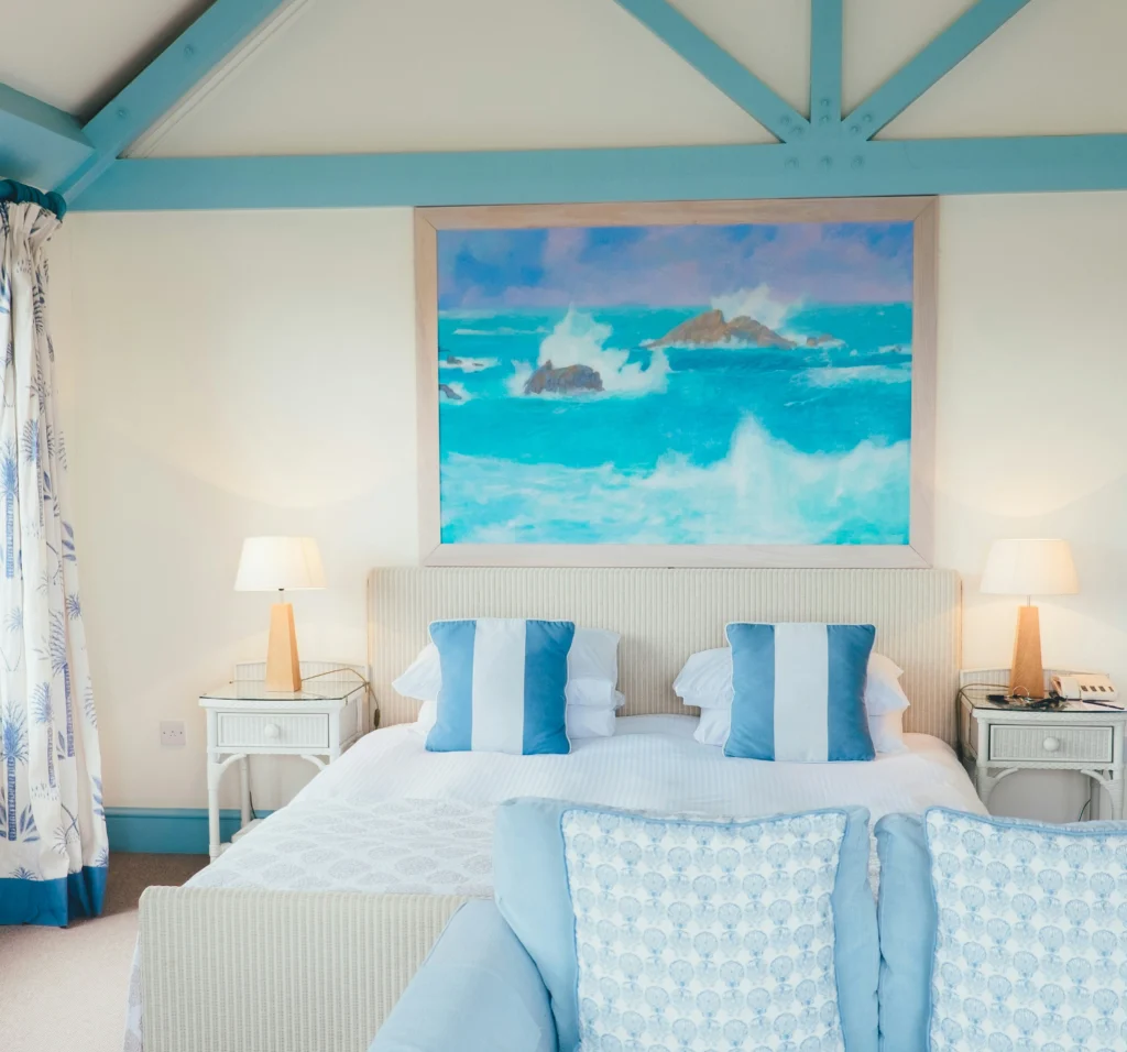 Coastal blue bedroom with ocean artwork
